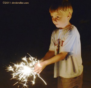 Nephew and sparkler on July 4, 2011. Photo by Chris Kridler, chriskridler.com