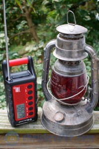 MIdland's ER300 weather radio is shown with an old railroad lantern for size comparison. Photo by Chris Kridler, ChrisKridler.com