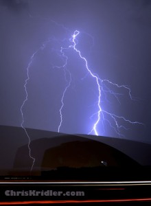 Car obscures a lightning shot