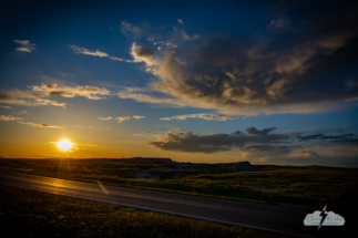Sunset over the road at Badlands National Park in South Dakota.