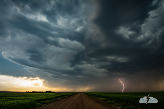 Lightning on a farm road north of Gove City, Kansas.