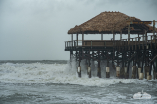 Waves rushing under the pier.