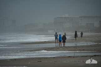 Spectators came to watch the storm at Cocoa Beach.