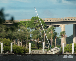 Hurricane Nicole threw a sailboat into the shore at Cocoa Village.