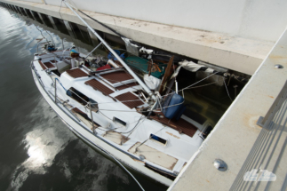 A boat crashed into the waterfront at Cocoa Village during Hurricane Nicole.