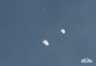 The boosters left poofs of vapor in their wake as they descended to Earth.