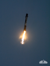 The "sooty" booster fires to slow its descent to Earth.