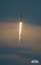 The Falcon 9 lifts into a beautiful twilight sky.
