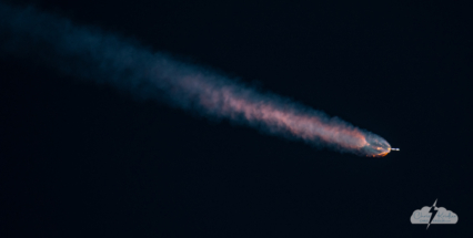 The Falcon 9 rocket and its fiery tail.