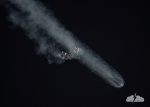 Two boosters burn after separation, preparing to return to Cape Canaveral.