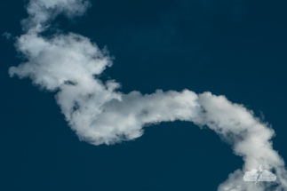 A piece of the contrail left by the SpaceX Falcon 9 rocket.