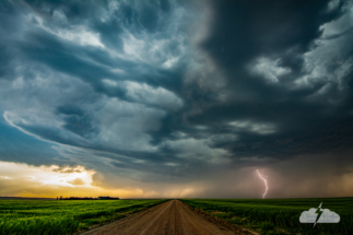 Lightning on a farm road north of Gove City, Kansas, May 17, 2022. Photo © Chris Kridler, ChrisKridler.com
