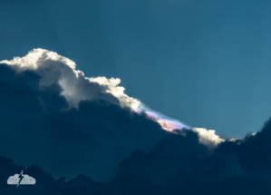 As one pileus cap faded, another formed on another updraft tower, and the iridescence reappeared there. Photo by Chris Kridler, ChrisKridler.com