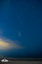 Stars and clouds and a brief meteor over the Gulf of Mexico in the wee hours of Oct. 22, 2023.