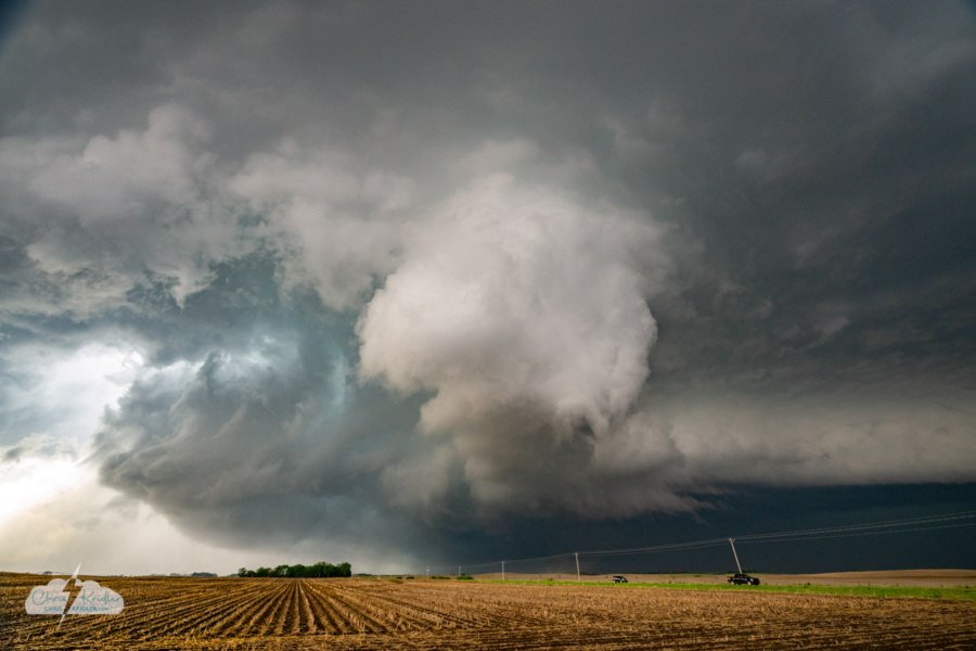 Tornadogenesis. The tornado begins right in front of us (see dirt in the distance). Note: Power lines removed in editing.