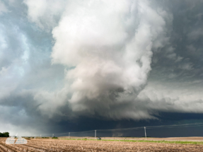The tornado spins under the rotating storm.