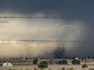 To the west, the storm's dust became something more - a nice landspout tornado.