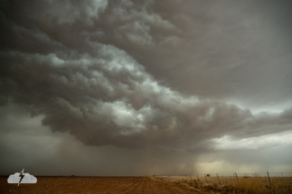 When that was over, we moved north a mile or so on the dirt road to watch this storm as outflow boundaries from the various convection approached.