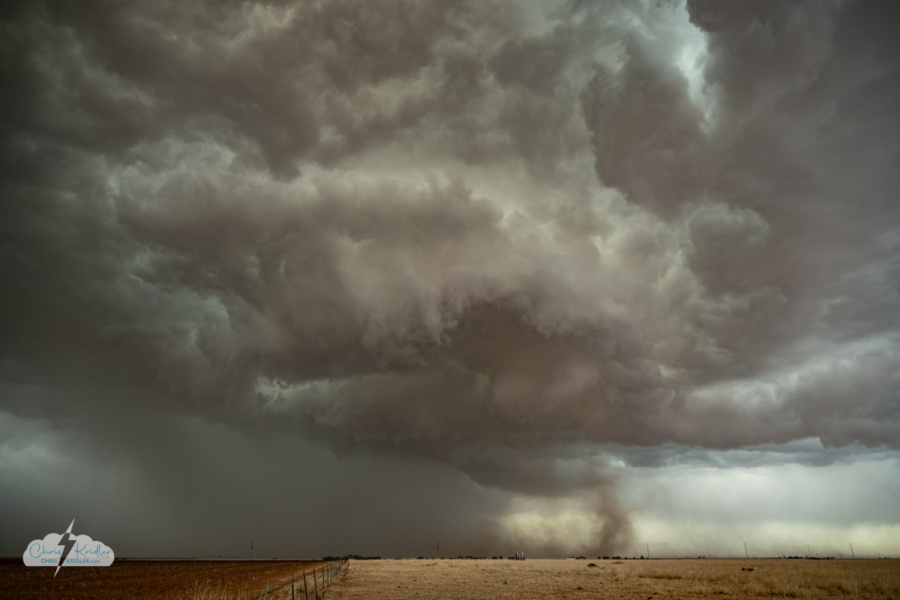 Dust spins under the storm.