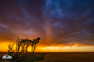 The virga (rain not hitting the ground) is lit up orange. The virga (rain not hitting the ground) is lit up orange.