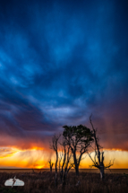The blue shows through above the orange sunset. The blue shows through above the orange sunset.
