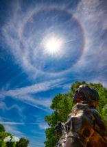 Dorothy looks up at the sun halo at the Land of Oz. The bright specks are from the cottonwood trees. Dorothy looks up at the sun halo at the Land of Oz. The bright specks are from the cottonwood trees.