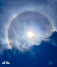 A phone shot of the partial sun halo created by the fragmented cirrus clouds. A phone shot of the partial sun halo created by the fragmented cirrus clouds.
