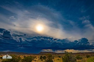 I "overcooked" this photo shot near Young Place, New Mexico, south of Santa Fe, to try to bring out the fading sun halo. I "overcooked" this photo shot near Young Place, New Mexico, south of Santa Fe, to try to bring out the fading sun halo.