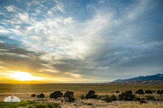 Sunset over the plains, dunes and Sangre de Cristo mountain range.