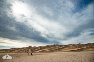 Tourists carry their toys so they can play in the dunes.