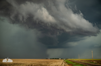 Heavy precipitation falls from the storm.