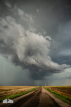 I love this vertical shot with the storm overtaking the road.