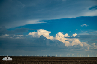 Distant convection over the wind turbines.
