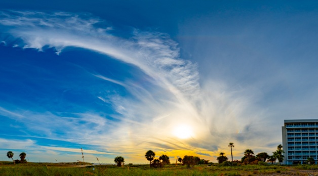 Stitching of this multishot panorama stretches it out a bit, but there's a circumzenithal arc here, a supralateral arc below it (or is it a 46 degree halo?). It's above the smaller 22 degree sun halo, which also sports sun dogs on the left and right of the circle.